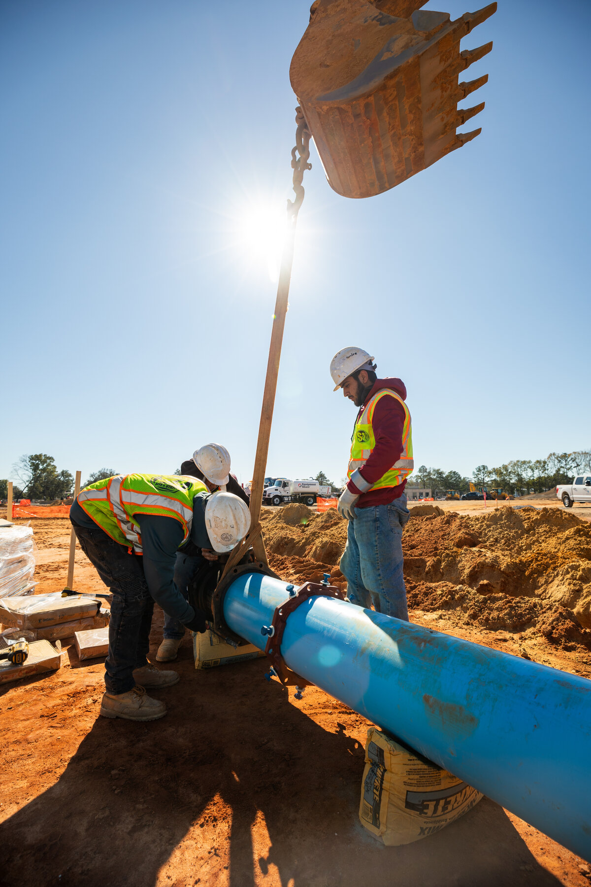 Site & Utility crews installing a water main