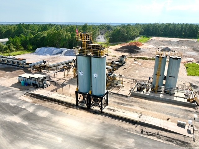 Freshly paved fuel-canopy site supplied by Site & Utility asphalt